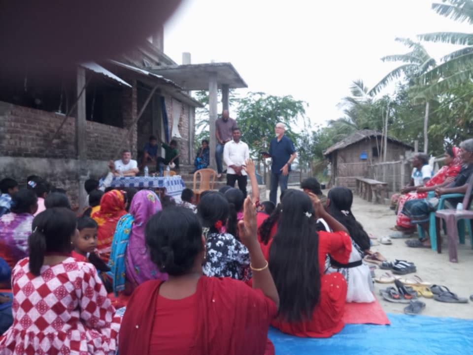 Community outreach gathering in a village setting